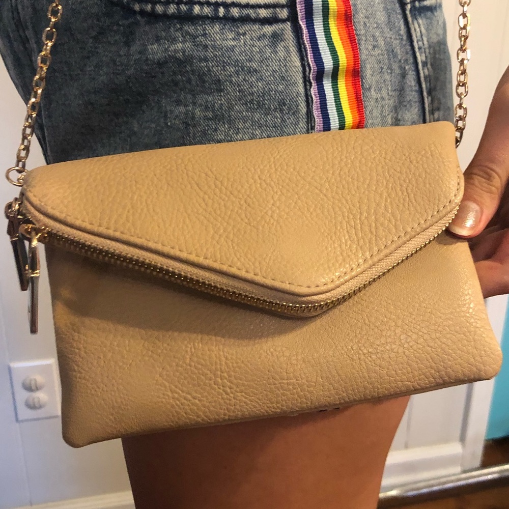 Small tan clutch on gold chain